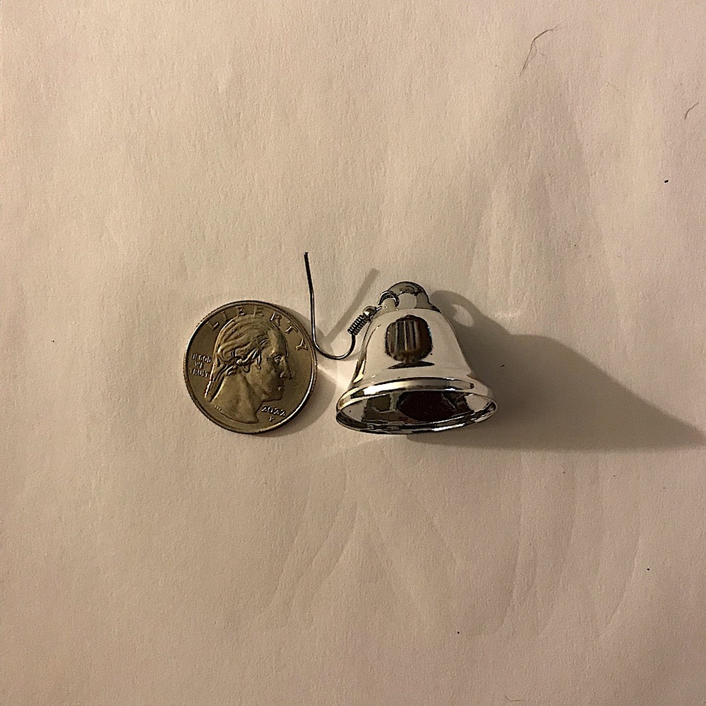 Size compared to a quarter: Silver bell Christmas earrings.